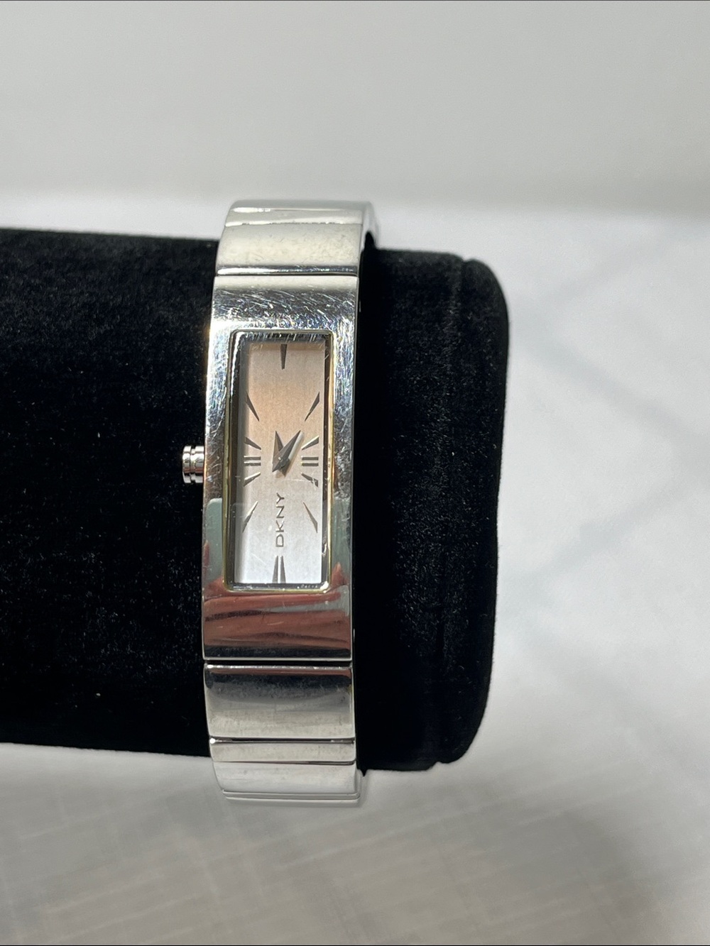 DKNY Silver Bangle Watch with Champagne-Tone Dial
Adjustable